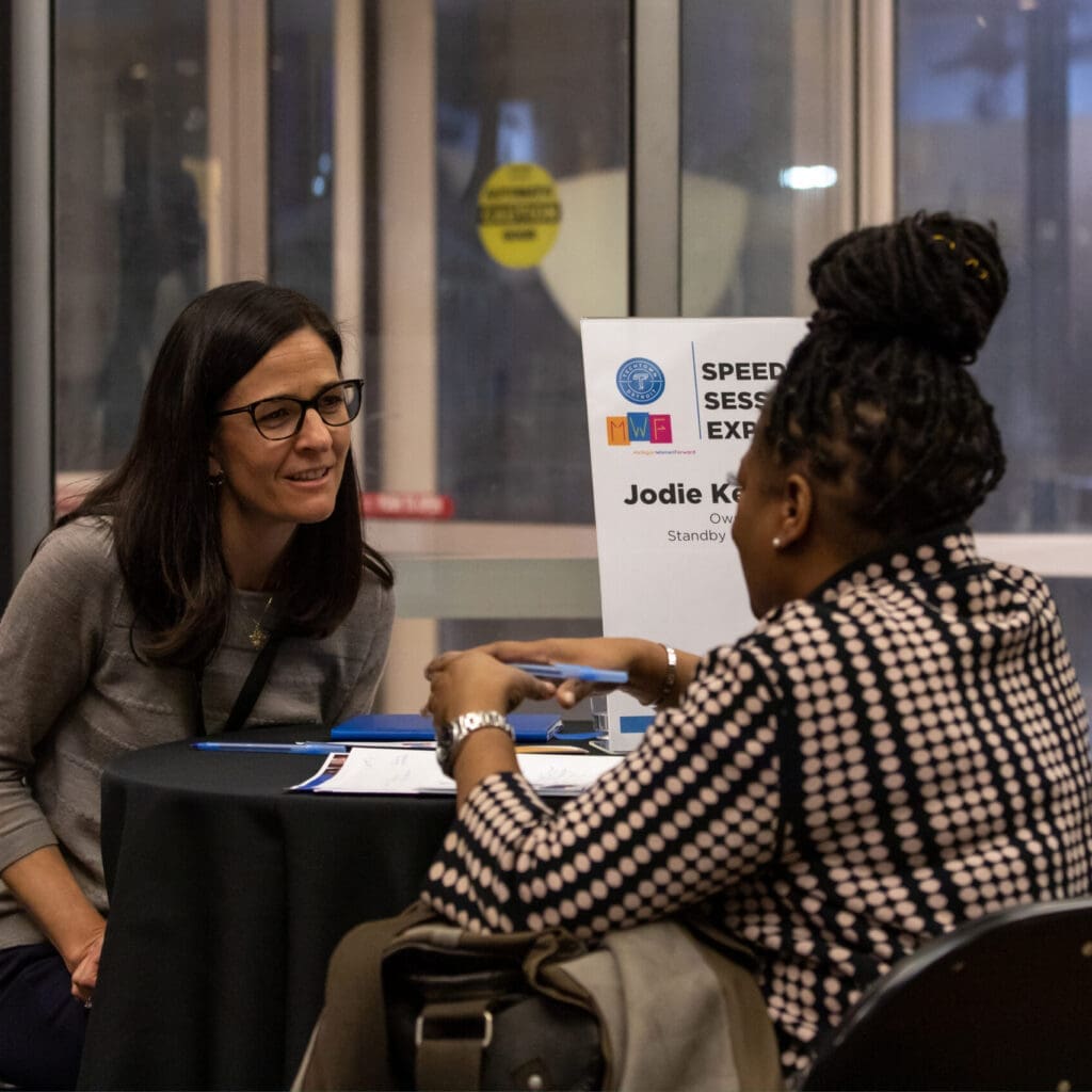 Two women talking at a table
